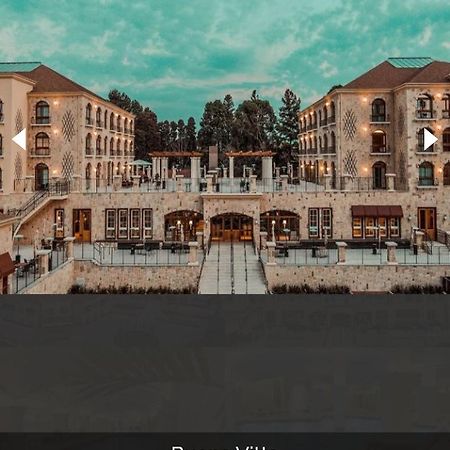 Buona Vitta Gramado Resort & Spa By Gramado Parks Екстериор снимка The photo shows a spacious and elegant building design, likely a hotel or resort. The structure features multiple stories and large windows, with outdoor seating areas visible on a terrace or patio. The exterior has a combination of stone and modern 